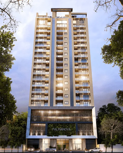 Edificio residencial moderno de varios pisos llamado Palmanova, iluminado al atardecer y rodeado de árboles.